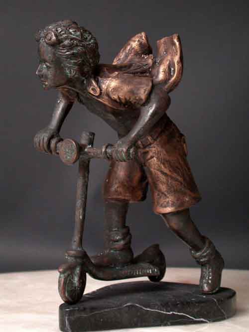 Scooter Child on Scooter Bronze Scupture
